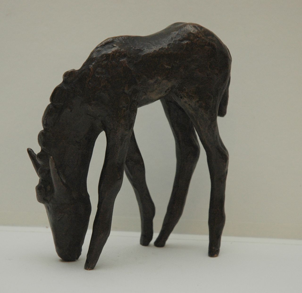 Baisch E.  | Ernst Baisch, Donkey foal, Patinierte Bronze 14,0 x 10,0 cm, signed with initials on nose